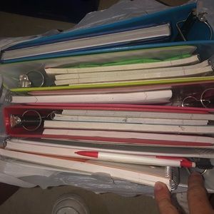 Assorted notebooks and binders